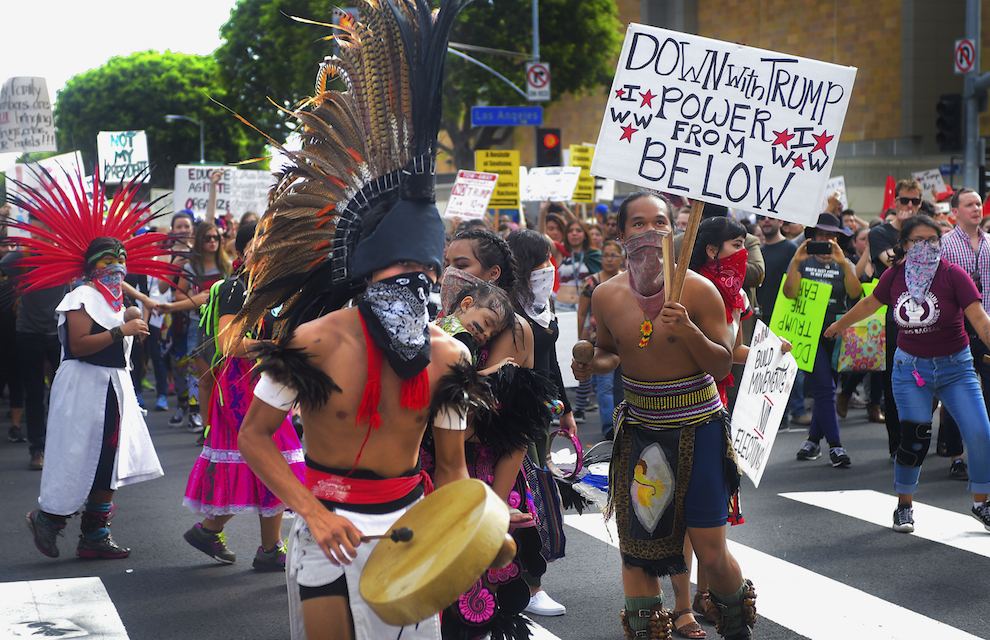 People participate in an anti-Trump protest in downtown Los Angeles on Saturday, Nov. 12, 2016. Thousands of people marched in streets across the United States on Saturday, continuing protests of Donald Trump’s election as president that started the day after his surprising victory. Several thousand people marched through downtown streets Saturday to condemn what they saw as Trump's hate speech about Muslims, pledge to deport people in the country illegally and crude comments about women. (Walt Mancini/The Pasadena Star-News via AP)